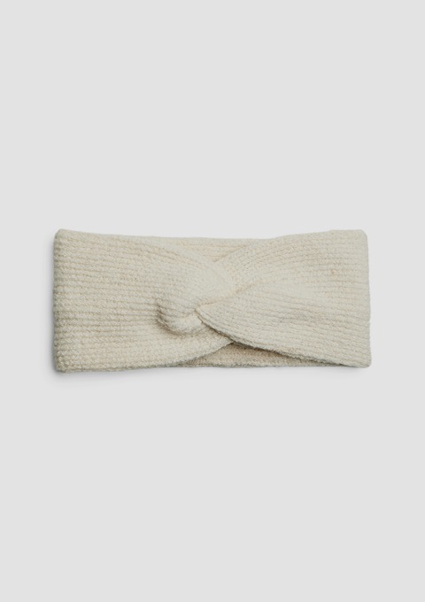 Ein weißes, gestricktes Haarband mit einer Knoten-Detail.